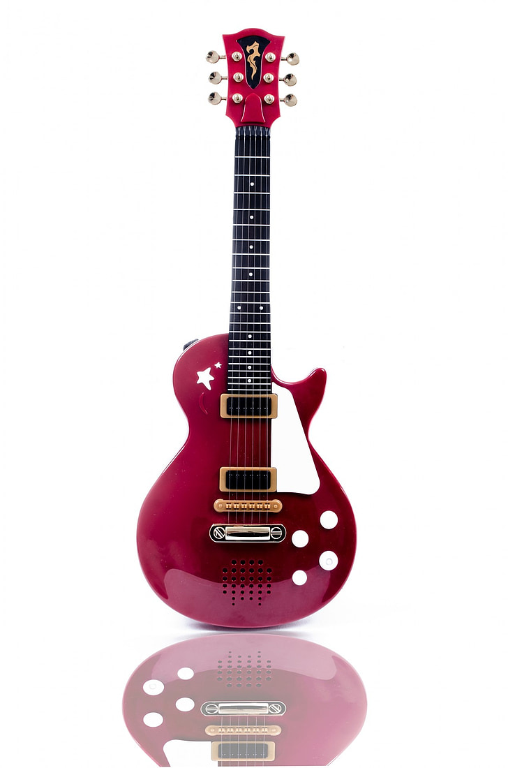 Front view of a red single-cut electric guitar